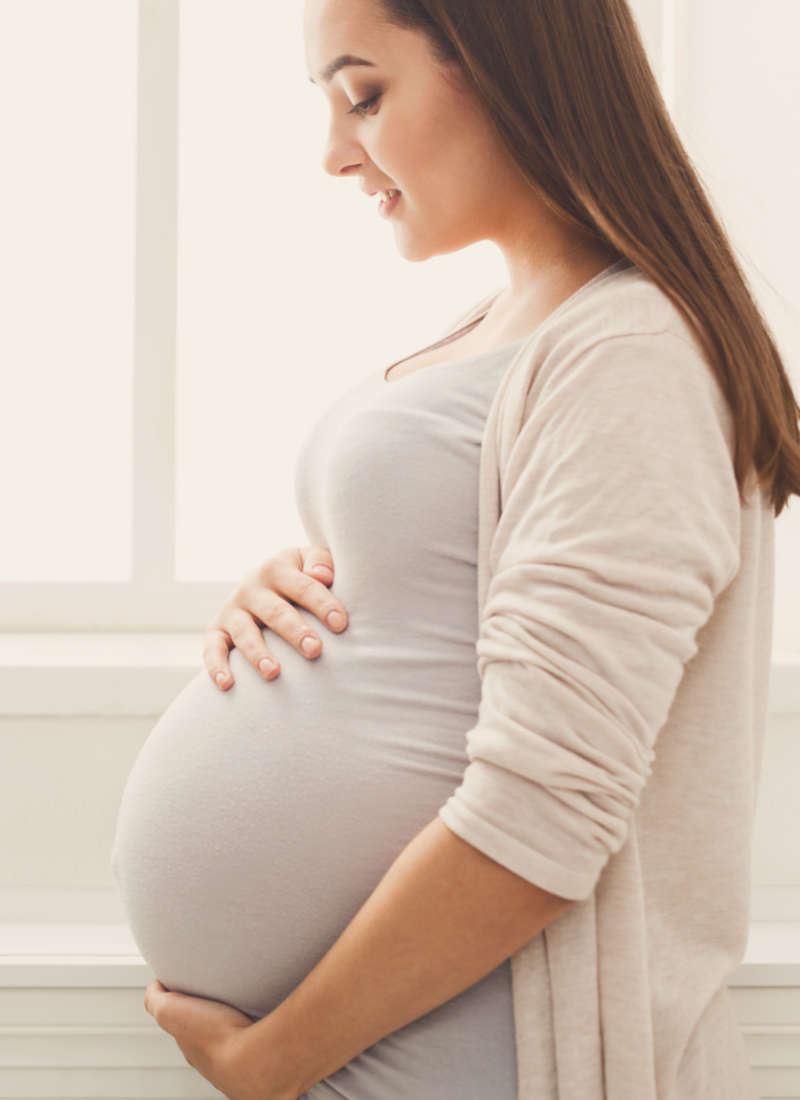 pregnant lady with hands on belly